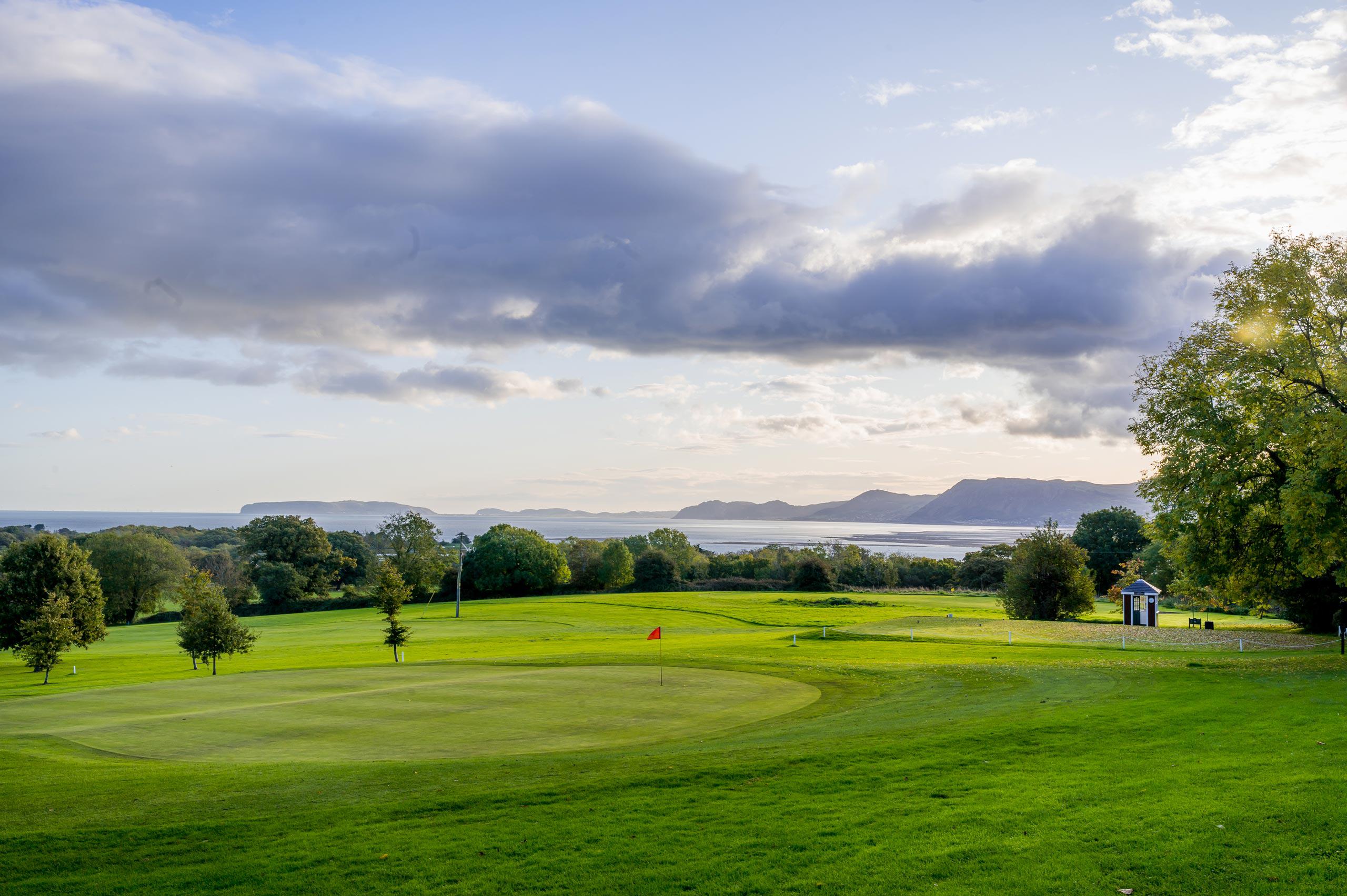View of a golf course in Beaumaris overlooking the sea and north Wales coast