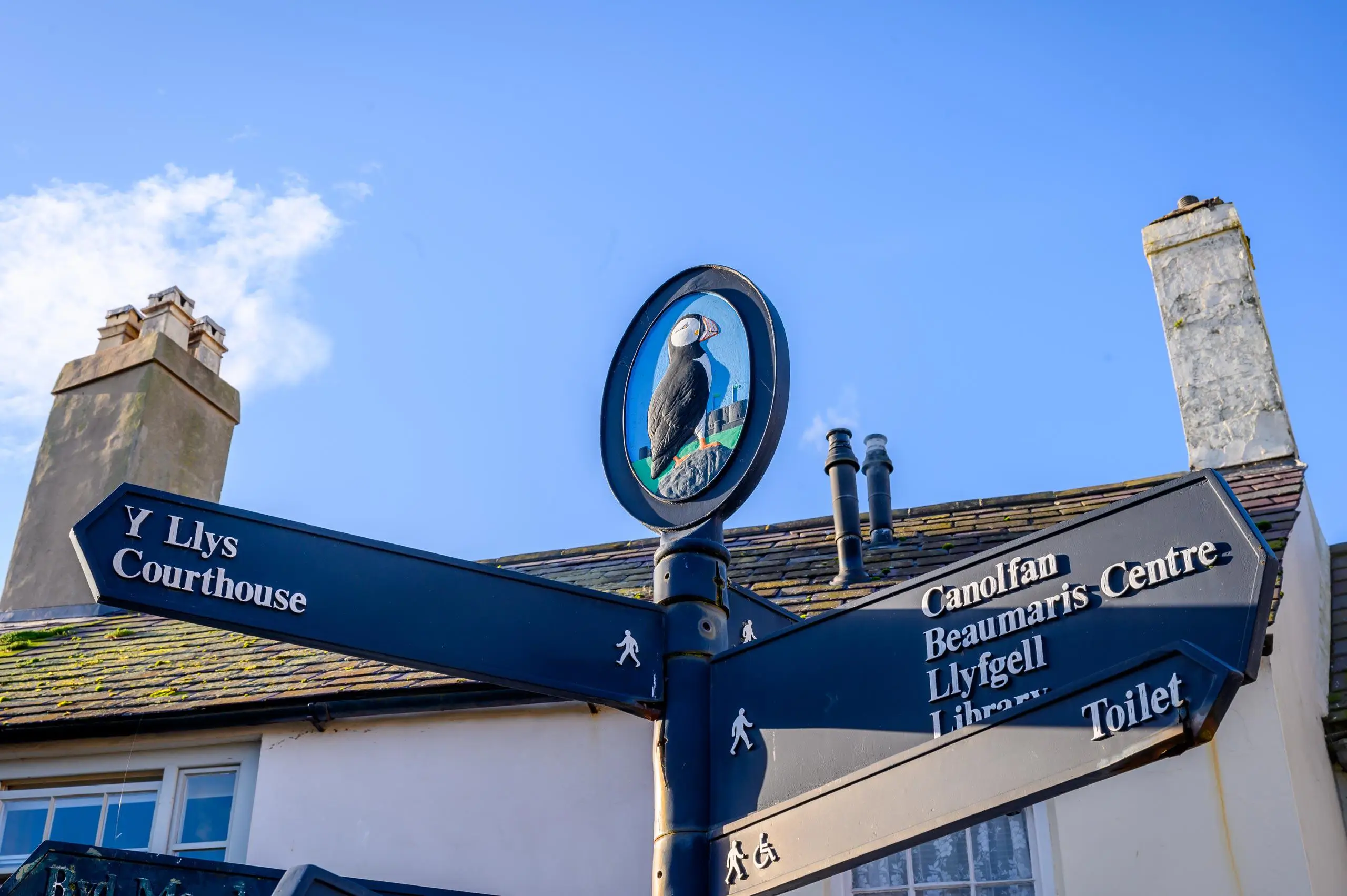 A sign in Beaumaris giving directions to the Courthouse, the Beaumaris Centre, library and toilets